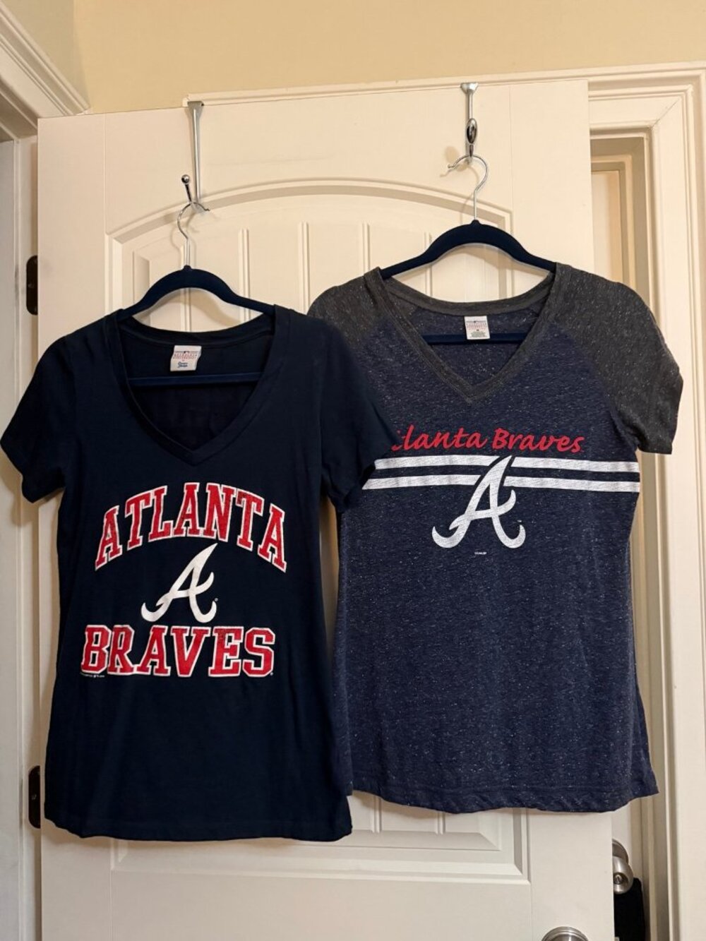 Two women’s medium Atlanta Braves T-shirts